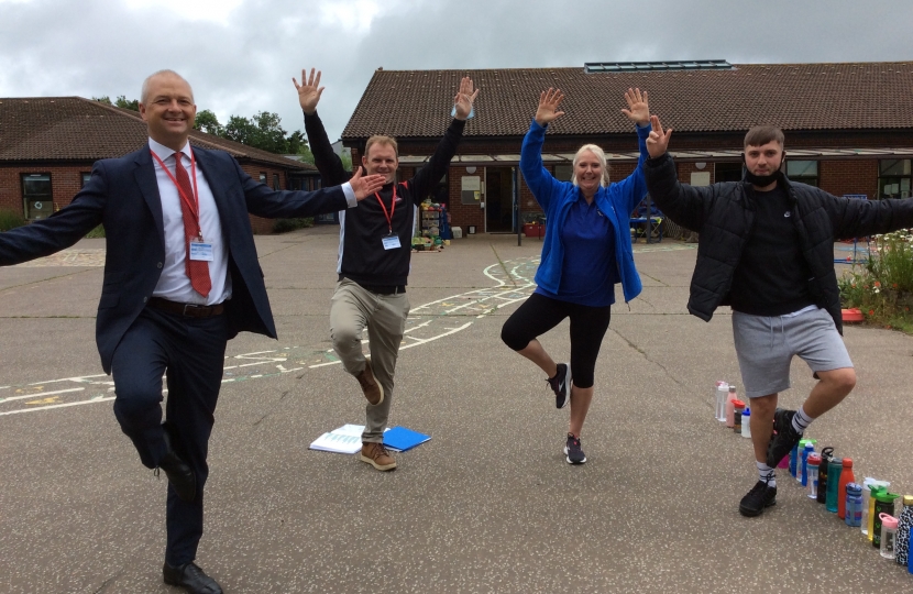 Jerome and teachers from Drayton Infant School doing yoga