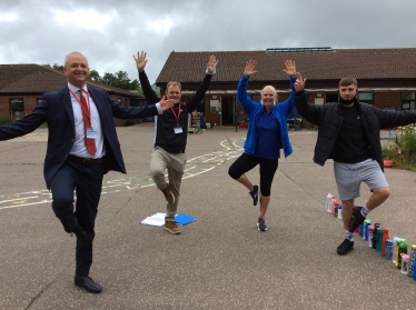 Jerome and teachers from Drayton Infant School doing yoga